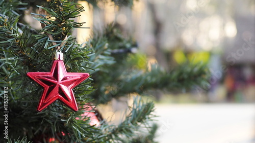 Christmas tree close-up background with sparkle.and glowing bokeh lights on a vibrant red background