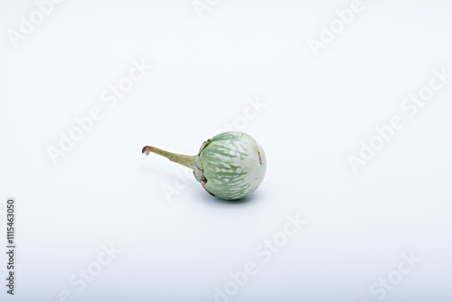 Healthy green round mini eggplant vegetable photographed with white base and background