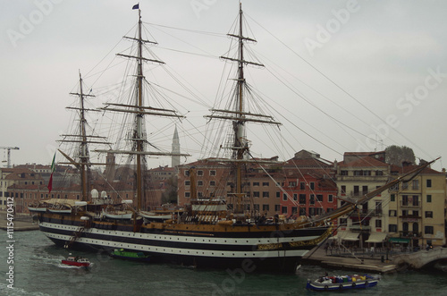 Italian marine or navy sailing cadetship or training ship Amerigo Vespucci docked in port of Venice, Italy on grey and foggy day photo