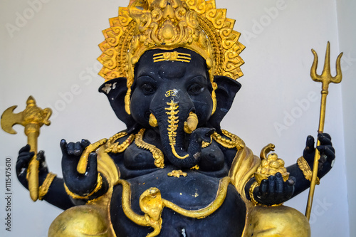 Ganesha statue Decorated with Gold color at Wat Pa Daed temple, Muang Chiang Mai, Chiang Mai, Northern Thailand photo