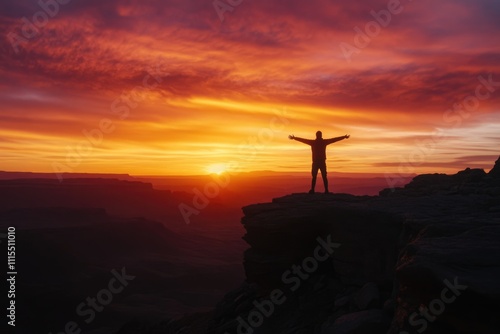 Man enjoys sunset on cliff overlooking vast canyon. photo