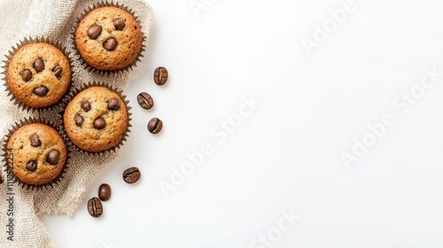 Freshly Baked Coffee Muffins with Coffee Beans top view on White Background