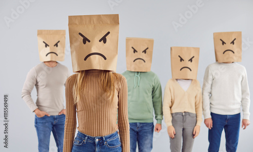 Obraz na płótnie Unsatisfied customers in bad mood with paper bags on heads Portrait of incognito