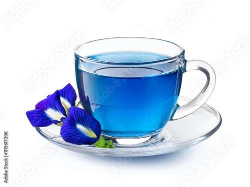 Glass cup of organic blue butterfly pea flower tea (blue pea, bluebellvine, cordofan pea, clitoria ternatea) isolated on white background.