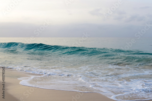 Beautiful turquoise waves of Atlantic Ocean on grey gloomy day in Cabo Verde.