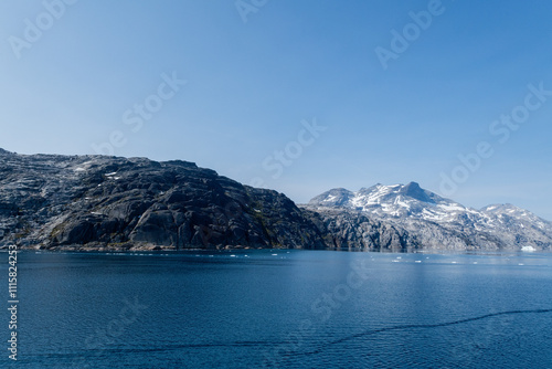 Prins Christian Sund Greenland mountain fjord with floating ice and shore iceberg on a summer day photo