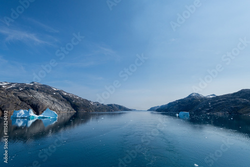 Prins Christian Sund Greenland mountain fjord with floating ice and shore iceberg on a summer day photo