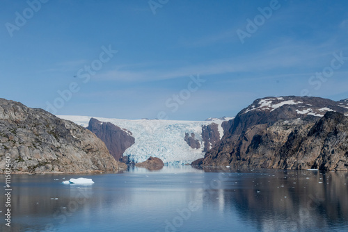 Prins Christian Sund Greenland mountain fjord with floating ice and shore iceberg on a summer day photo