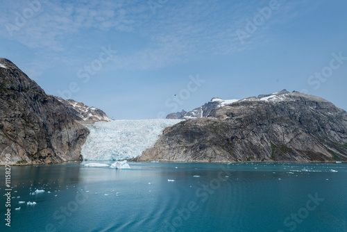 Prins Christian Sund Greenland mountain fjord with floating ice and shore iceberg on a summer day photo