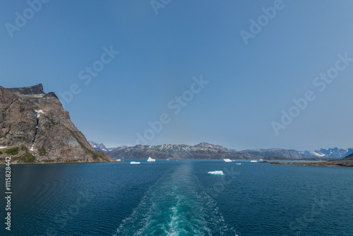 Prins Christian Sund Greenland mountain fjord with floating ice and shore iceberg on a summer day