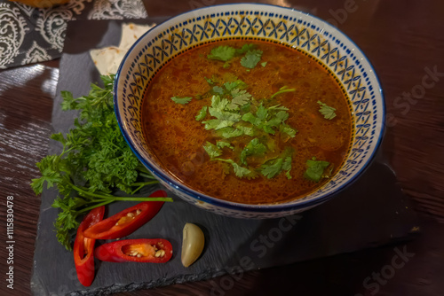 Serving of the traditional Georgian Kharcho soup in bowl photo