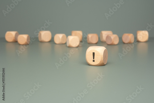 A set of Wooden Blocks with an Exclamation Point set against a vibrant Green Background