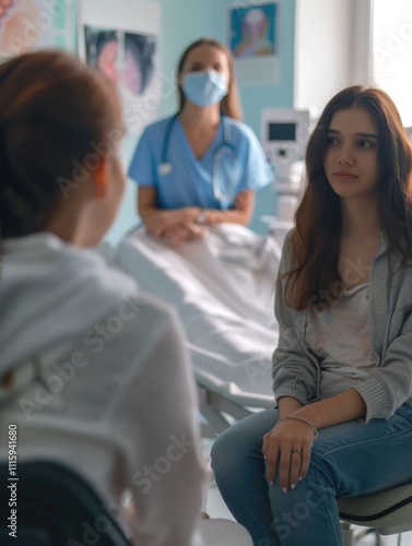 Two women in a hospital room; one is a patient receiving medical attention from the other, who is a nurse.