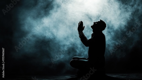 Man Praying in the Dark photo