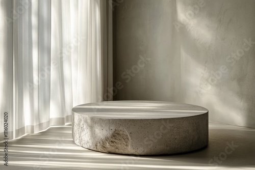 Minimalist round concrete stool placed in a sunlit modern interior with soft ...