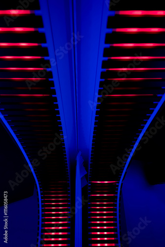 Illuminated Red and Blue Stripes on a Modern Column in Switzerland.