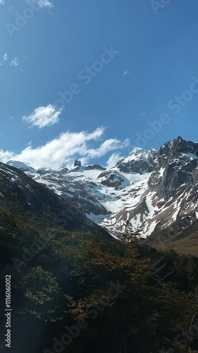 Timelapse of clouds on a snowy mountain in Ushuaia. Summer in Patagonia, Andes mountain range.