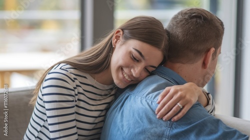 Free Download A woman embraces a man from behind, sharing a warm, intimate moment indoors. - GFXLoad