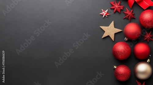Colorful Christmas ornaments and decorations arranged on a dark background fo...