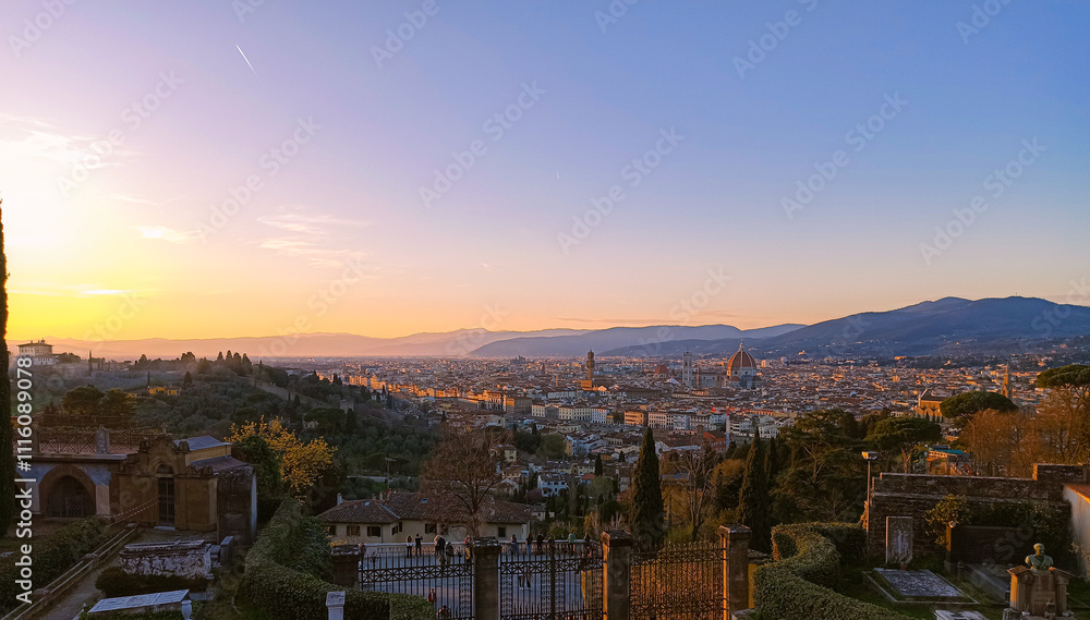 Fototapeta premium A breathtaking panoramic view of Florence at sunset, with the iconic Duomo and Brunelleschi's Dome dominating the skyline. The warm golden light casts a magical glow over the city, highlighting its hi