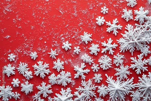 Decorative snowflakes arranged on vibrant red background for winter celebration