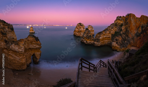 View of rock formation at Camilo beach in Algarve, Portugal after sunset