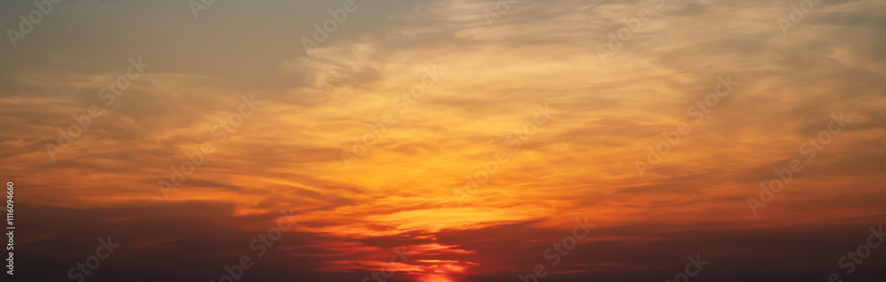 orange sunset in a cloudy sky with clouds. Background with sky at sunrise orange sunset in a cloudy sky with clouds. Background with sky at sunrise