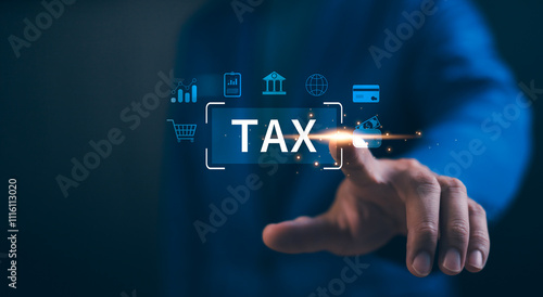 Concept of tax and financial technology.  Businessman touch a glowing TAX button on a digital interface, by finance-related icons. E-tax, online for tax payment concept. Calculation tax return.