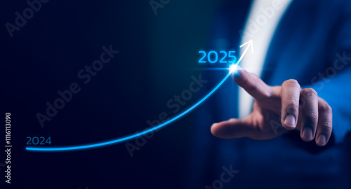 Start 2025 new year. Business growth 2024 to 2025. Businessman pointing at arrow graph New Year Business Goals 2025. Financial growth or rising interest rates. Future trends and strategic forecasting.