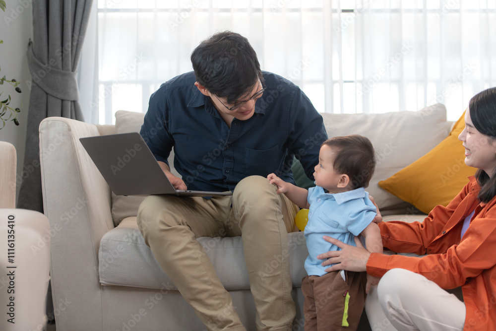 Fototapeta premium Parents and son play together after dad comes home from work