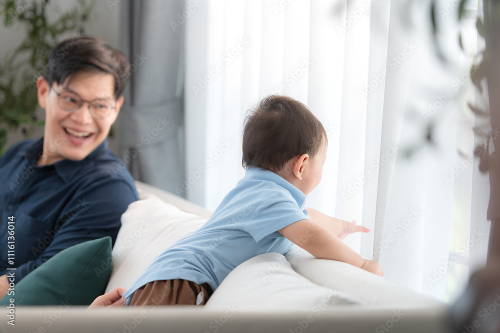 Father and son play together after dad comes home from work Father and son play together after dad comes home from work