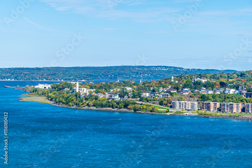 A view down from the Dufferin terrace across the Saint Lawrence river towards the northern part of the borough of Desjardins in Quebec city, Canada in the fall photo