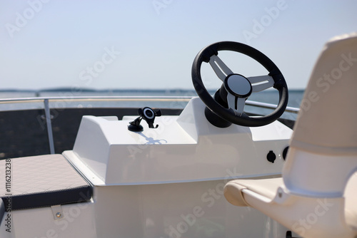 Luxurious motorboat flybridge steering wheel photo