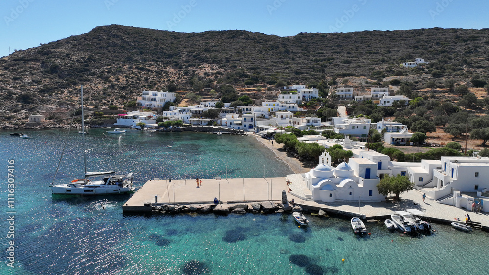 Aerial drone photo of picturesque seaside fishing village of Vathy featuring landmark chapel of Taxiarchis, Sifnos island, Cyclades, Greece