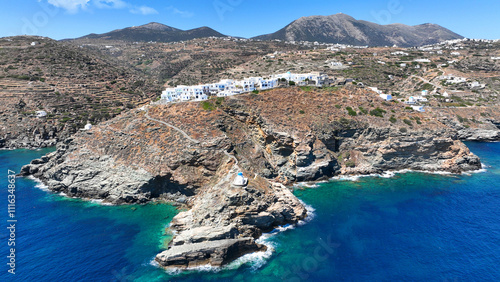 Obraz na płótnie Aerial drone photo of scenic cliff-top village of Kastro or Castle built in a rock overlooking the eastern coast of the island inhabited since the prehistoric period, Sifnos island, Cyclades, Greece w salonie