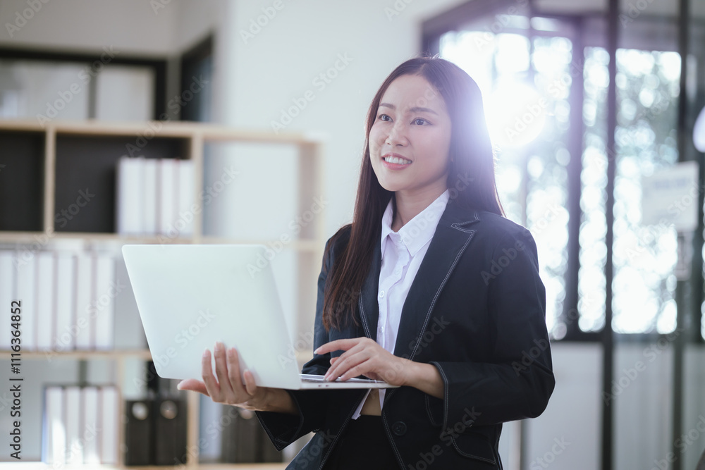 Beautiful Asian businesswoman in modern office Beautiful Asian businesswoman in modern office