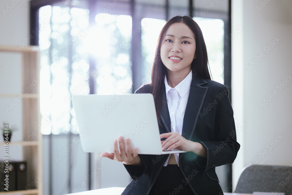 Beautiful Asian businesswoman in modern office Beautiful Asian businesswoman in modern office
