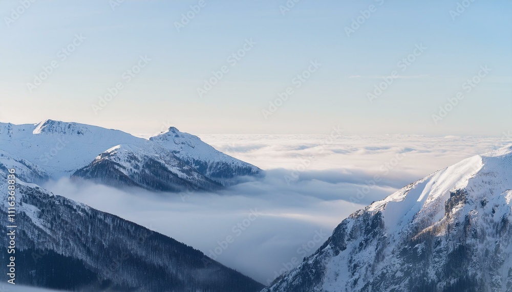 Obraz premium 산꼭대기 풍경 눈으로 덮인 산봉우리와 그 아래로 펼쳐진 운해