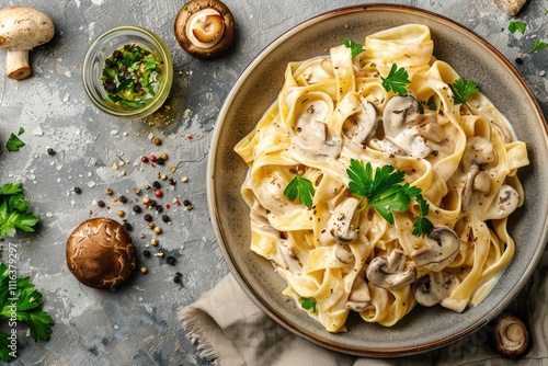 Creamy mushroom pappardelle pasta with parsley on stone background. photo