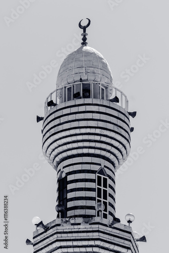 part of the Islamic minaret , against the background of a blue sky with clouds , the concept of the Muslim religion