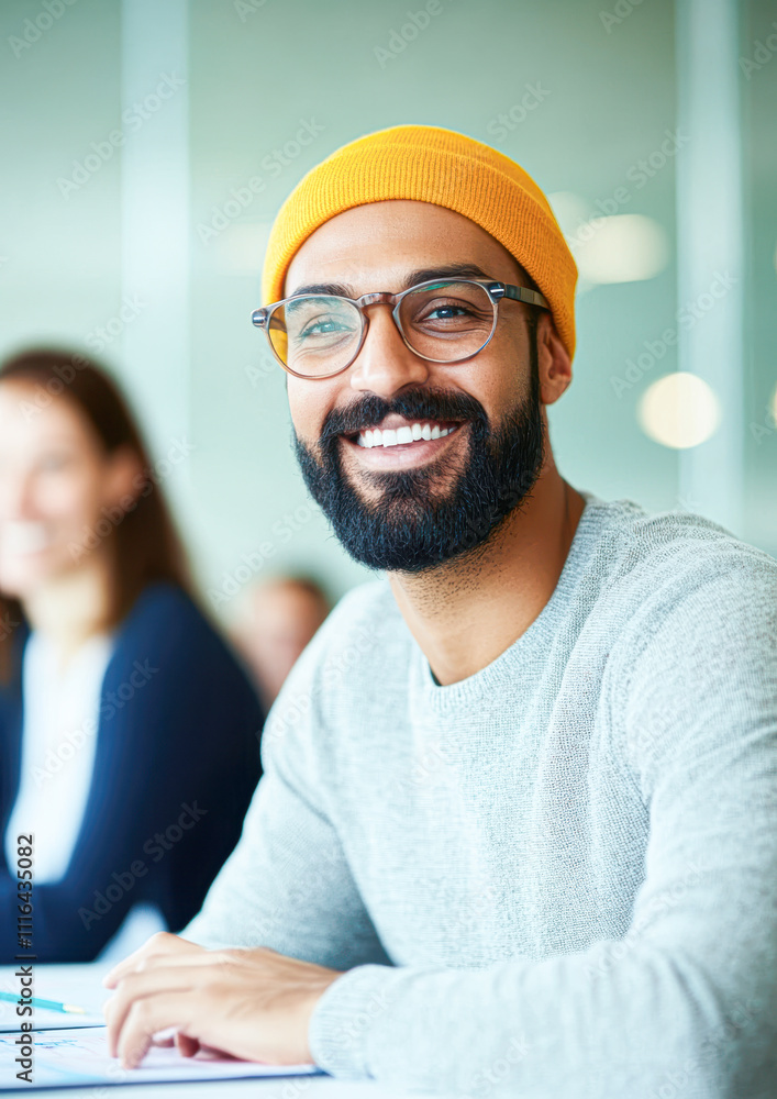 A man with glasses and a yellow hat is smiling A man with glasses and a yellow hat is smiling