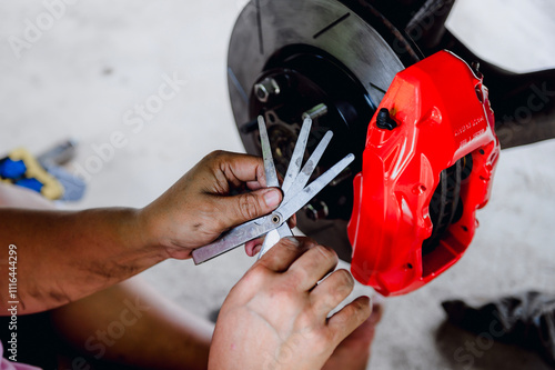 The feeler gauge is used to measure the distance between the two brake pads and see how far apart they are.