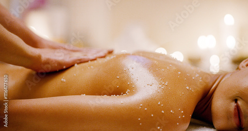 Hands, back massage and woman with oil, exfoliating and holistic spa center for wellness and zen. Masseuse, salt and stress relief with self care, healing and relaxation with cosmetic therapy peace