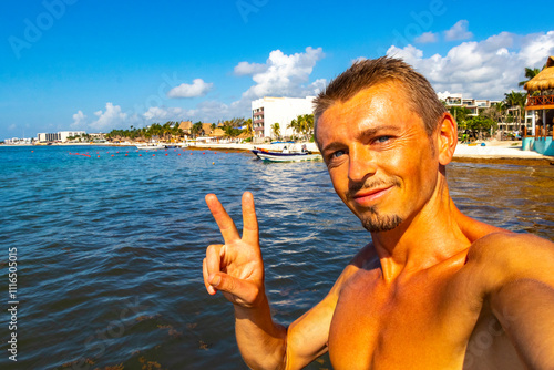 Male tourist Travelling man taking selfie Playa del Carmen Mexico. photo