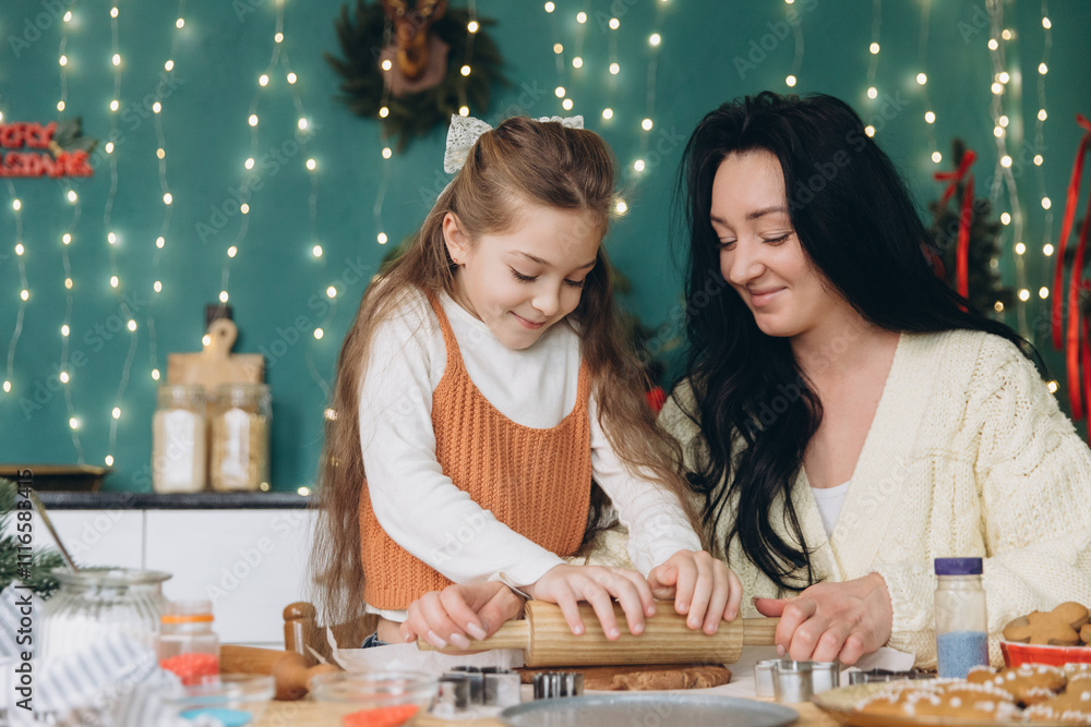 Fototapeta premium Mother and daughter making christmas cookies together