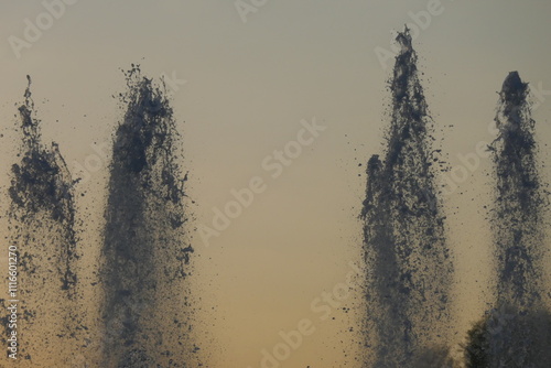 fontain jets at the park at sunset
