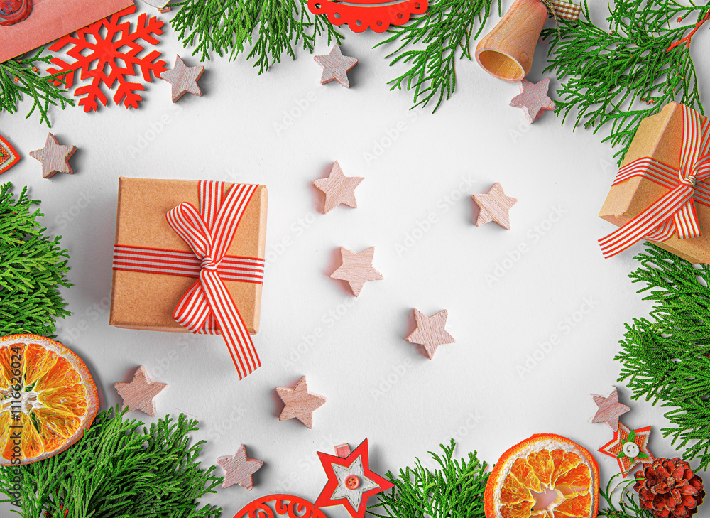 Christmas background. Christmas eve concept. Top view of gift boxes, fir branches, toys, on white background.