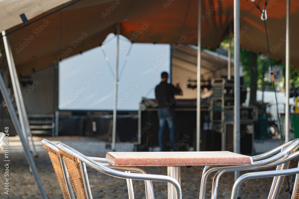 Fototapeta premium Outdoor venue setup for a community event featuring a stage and seating area