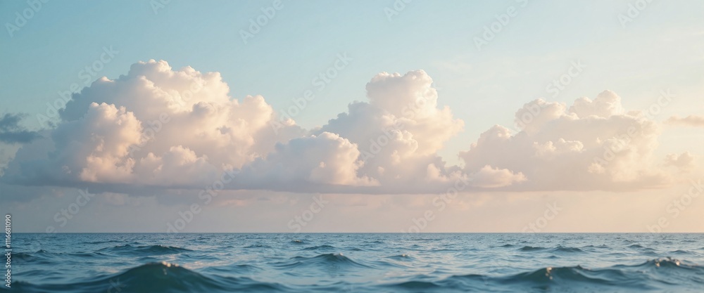 Obraz premium Serene Ocean Waves with Fluffy Clouds Against Pastel Sky with Copy Space