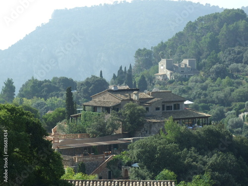 Scenic mountain view with villa in the countryside photo